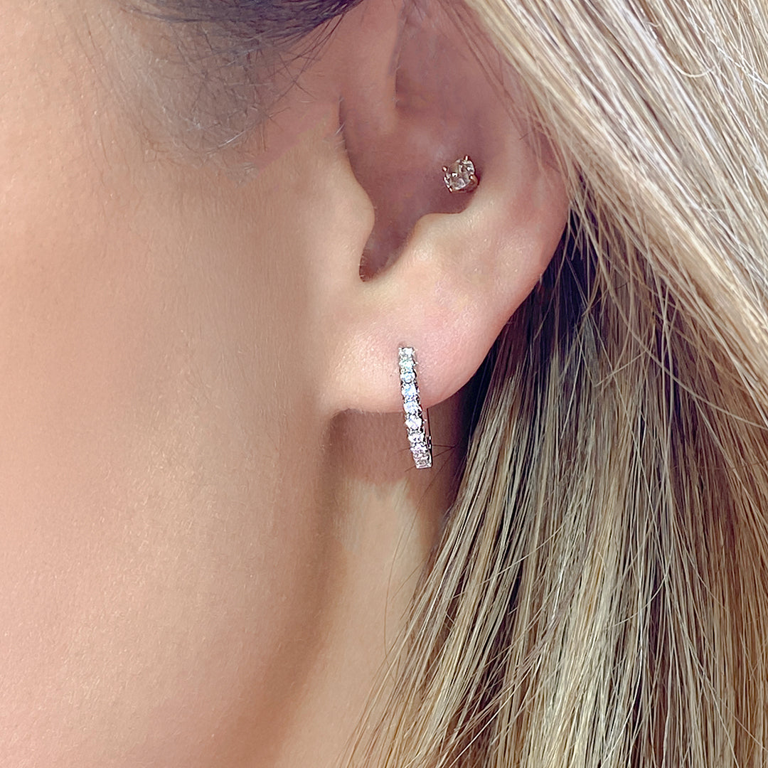 Huggie Earrings on Ear, White Gold, Diamond Pavé.