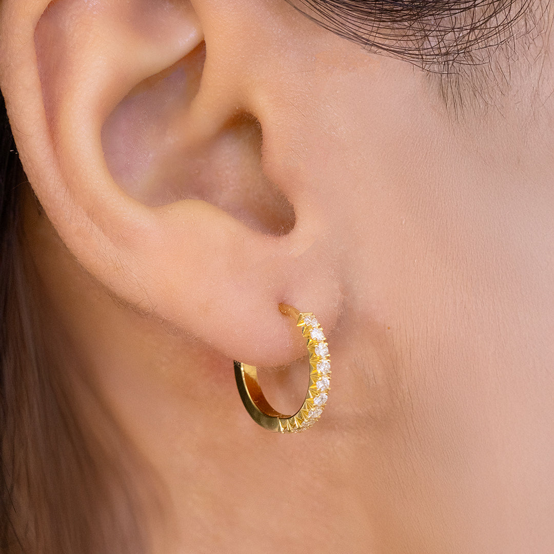 Huggie Earrings on Ear, Yellow Gold, Diamond Pavé.