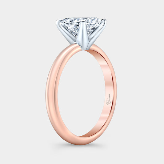 Two tone diamond ring on hand, princess solitaire.