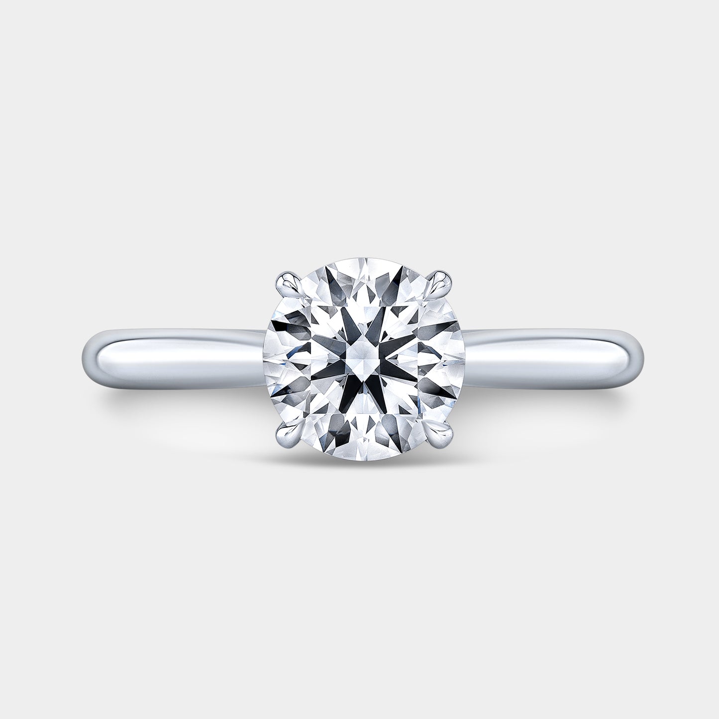 Platinum round ring, top view, hidden halo.