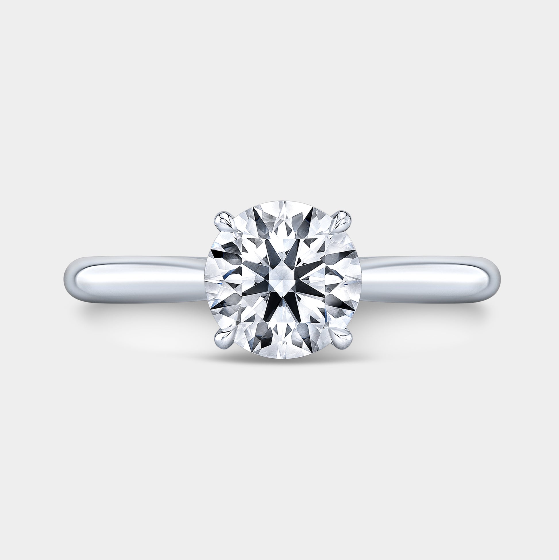 Platinum round ring, top view, hidden halo.