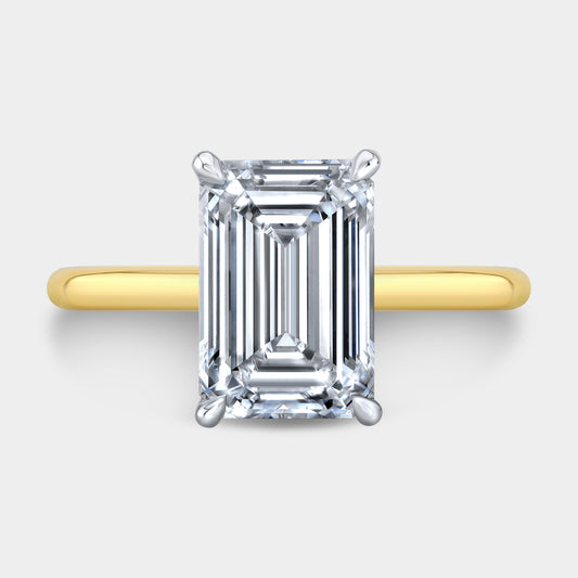 Two tone emerald ring, top view, Hailey solitaire.