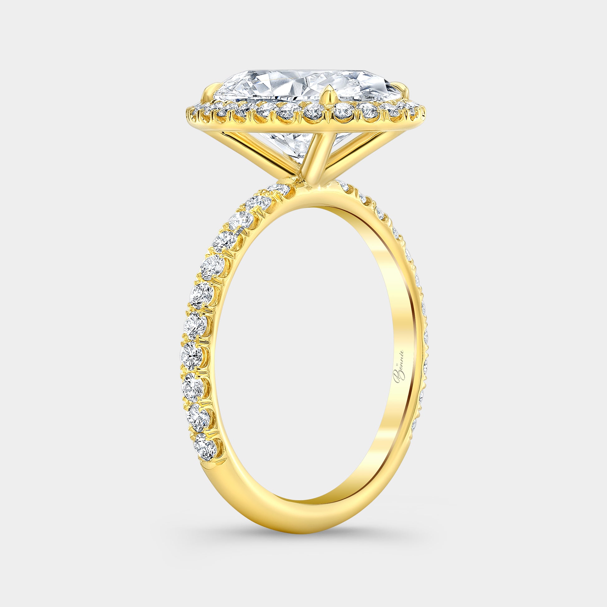 Yellow gold oval ring, 45 degree, petite halo.