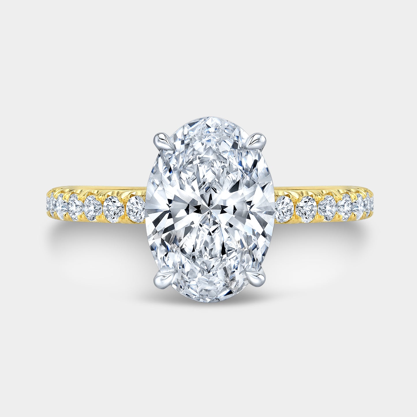 Two tone oval ring, top view, hidden halo.