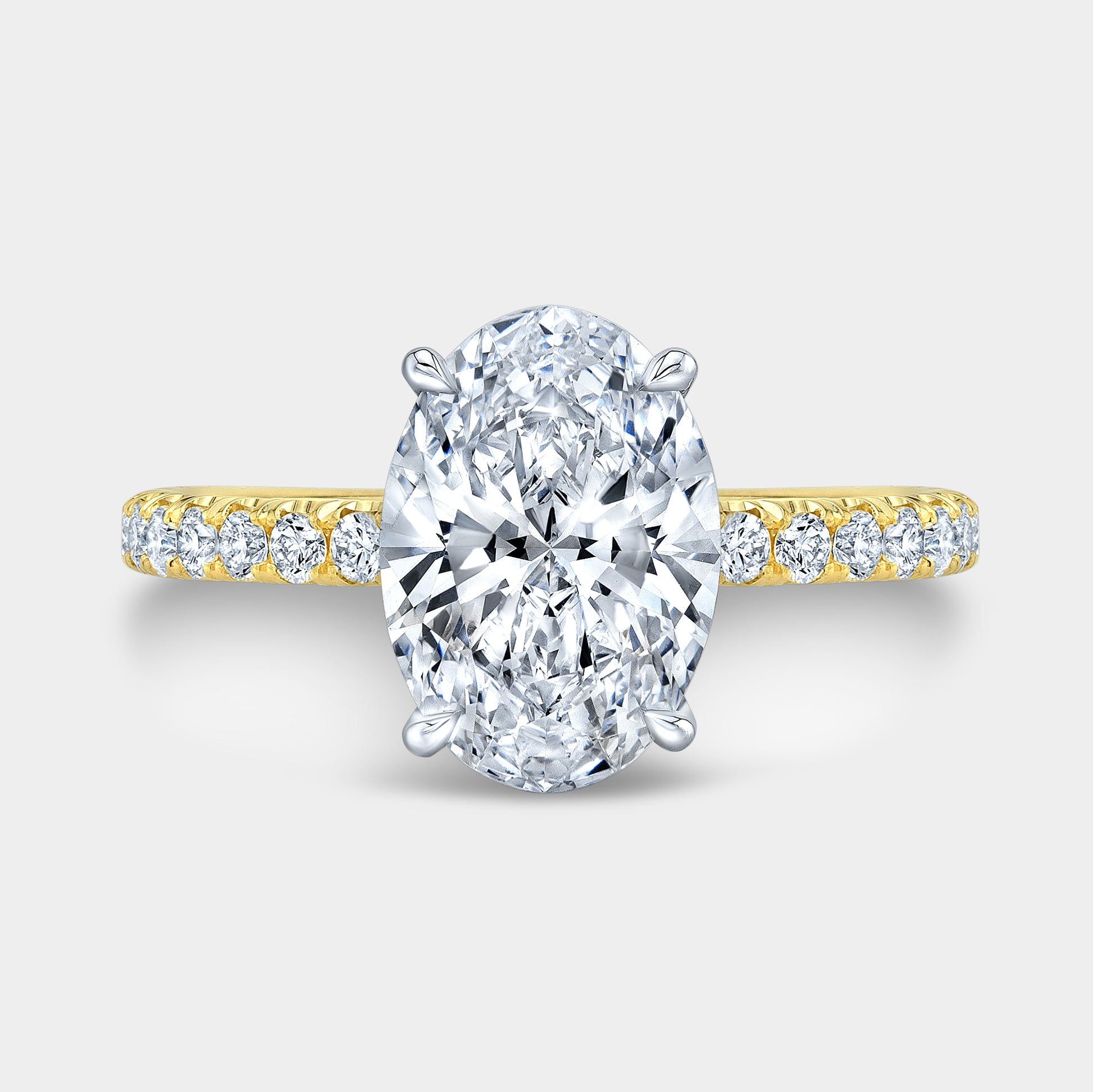 Two tone oval ring, top view, hidden halo.