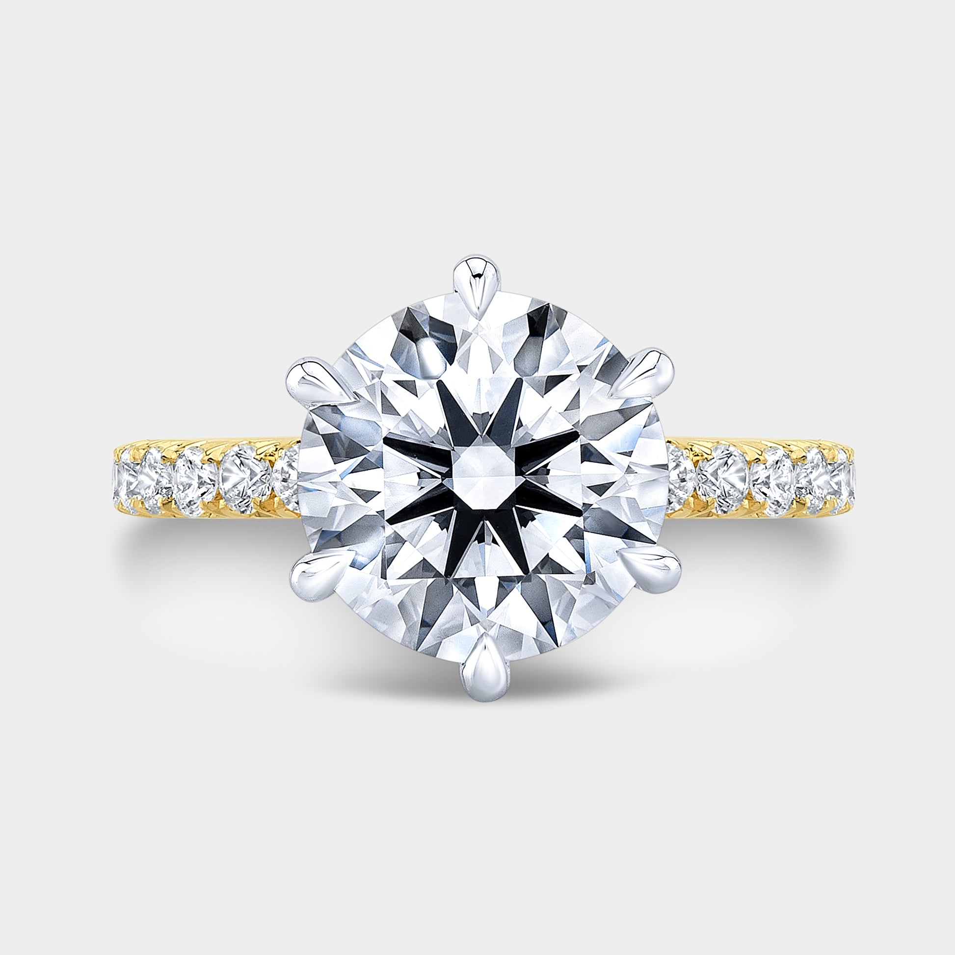 Round ring, top down, halo, pave, two tone setting.
