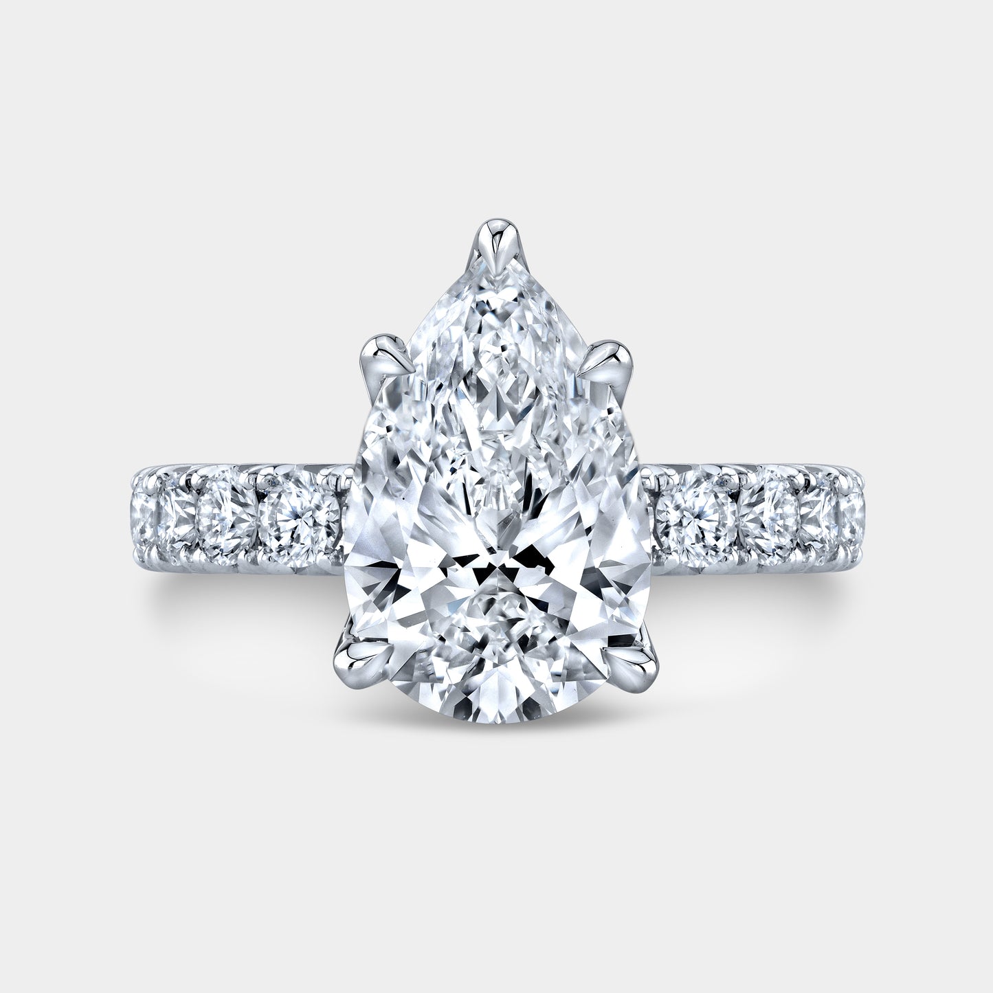 Pear diamond halo ring, white gold band.