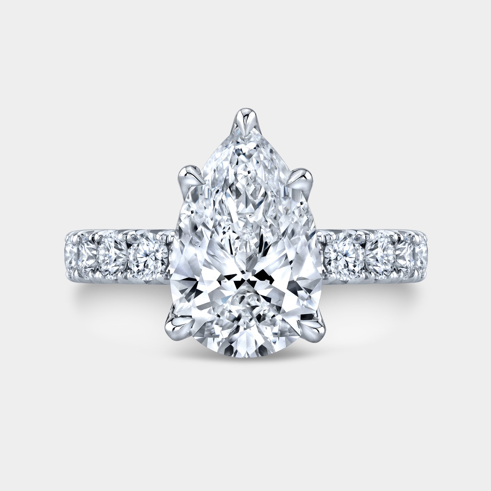 Pear diamond halo ring, white gold band.