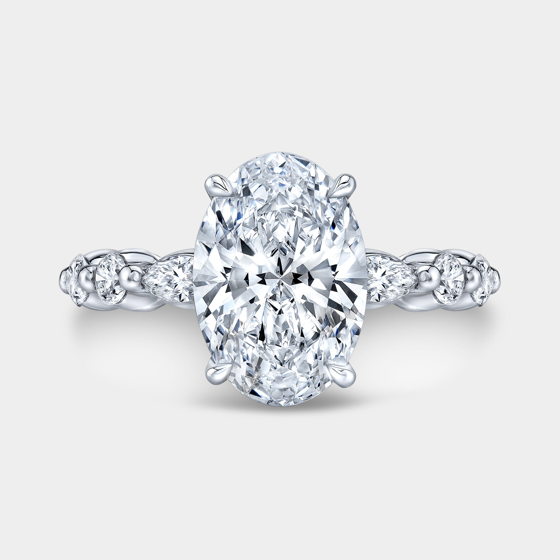 Oval diamond ring, hidden halo and marquise view.