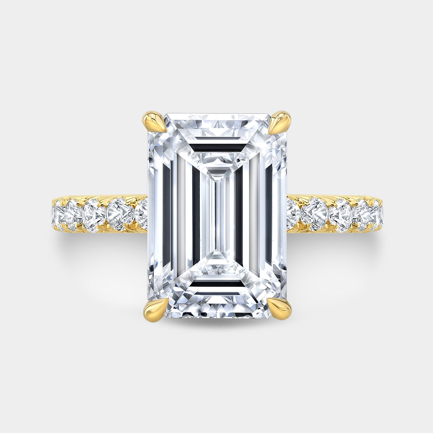 Yellow gold emerald diamond ring, top view, hidden halo.