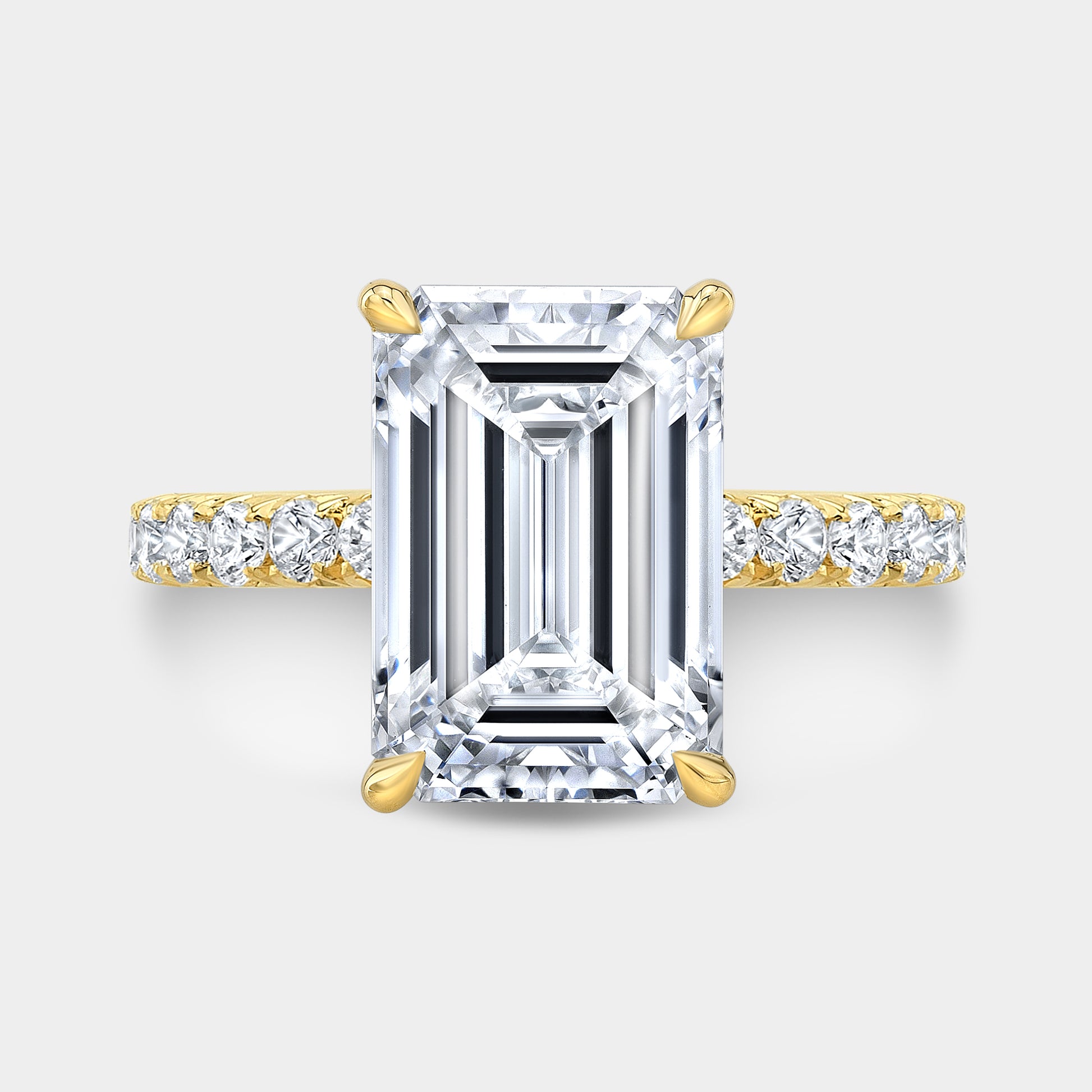 Yellow gold emerald diamond ring, top view, hidden halo.