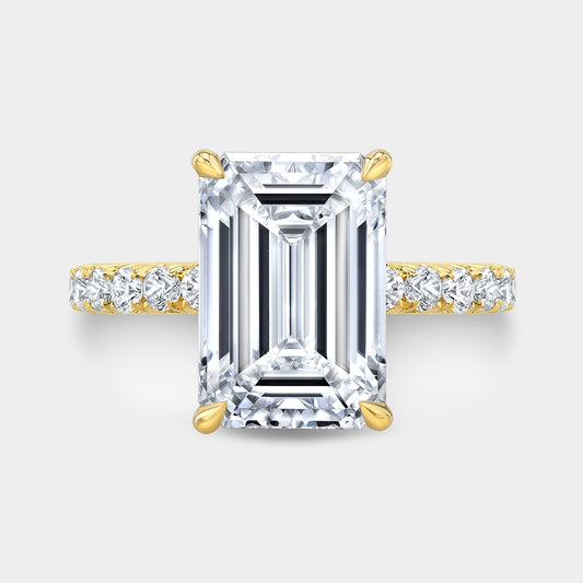 Yellow gold emerald diamond ring, top view, hidden halo.