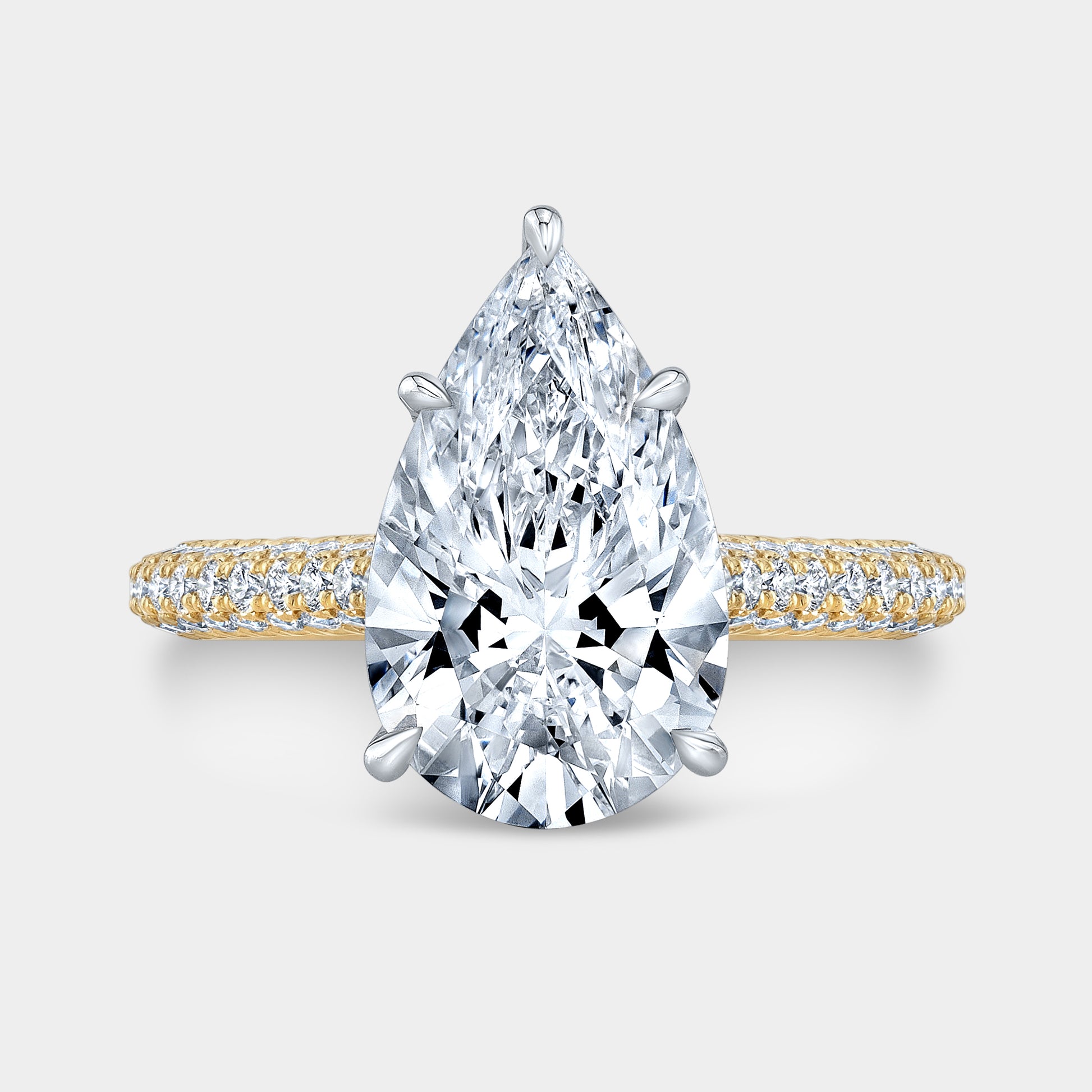 Two tone pear diamond ring, top view, hidden halo.