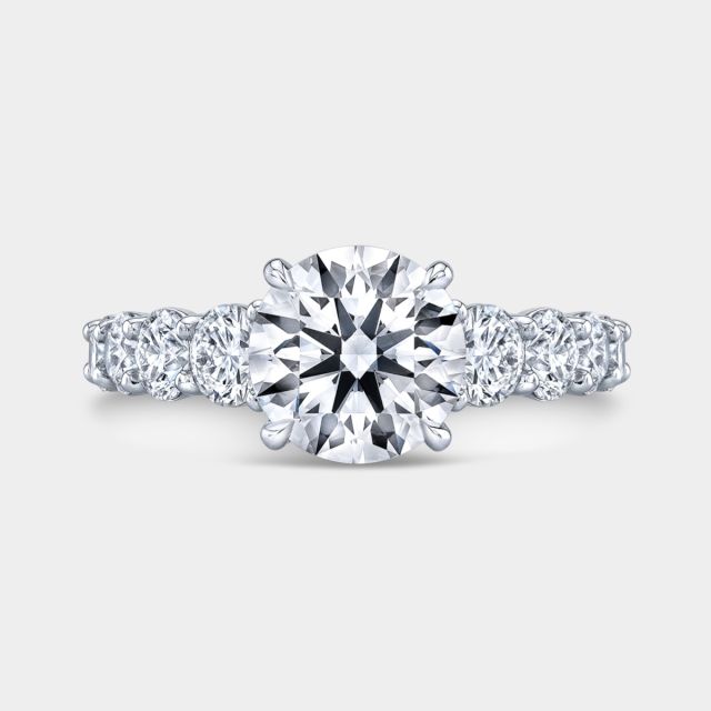 Platinum round diamond ring, top view, graduating.