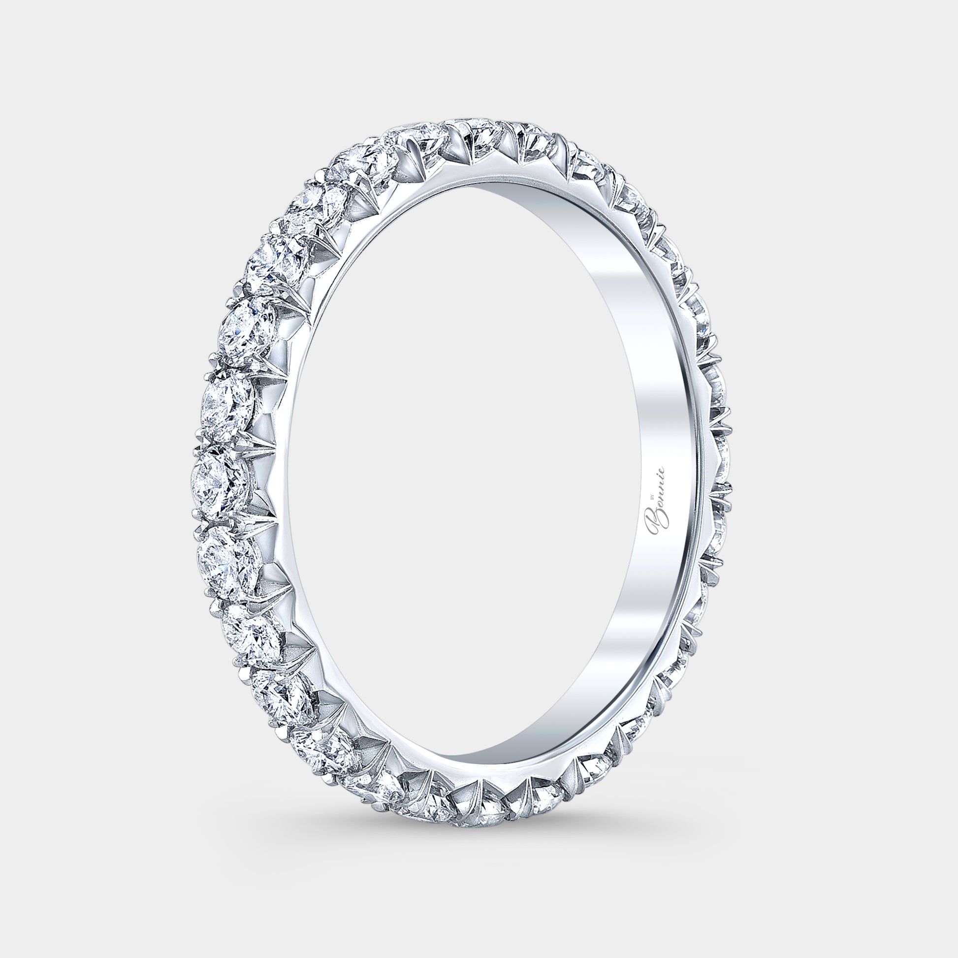 Platinum diamond band on hand, French pave.