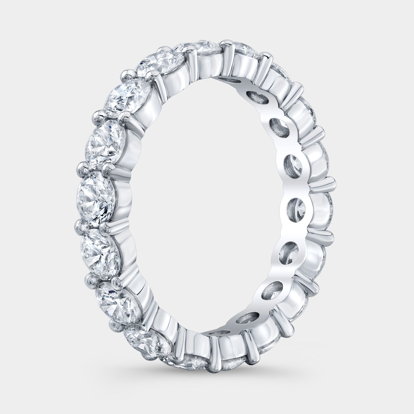 Platinum Eternity Band on Hand, Round Diamonds.
