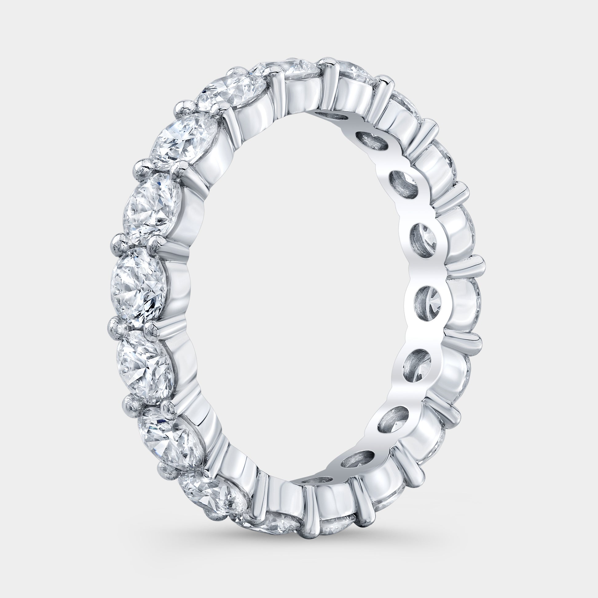 Platinum Eternity Band on Hand, Round Diamonds.