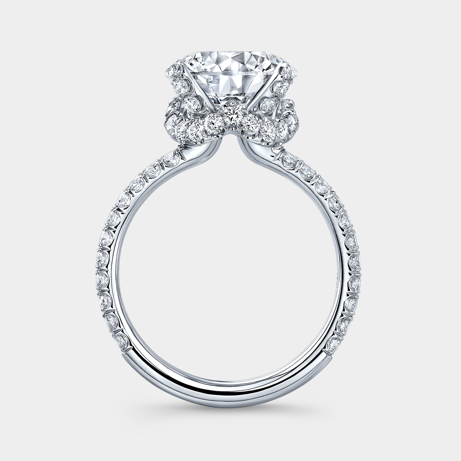 White gold ring, round diamond, double row U pave band.