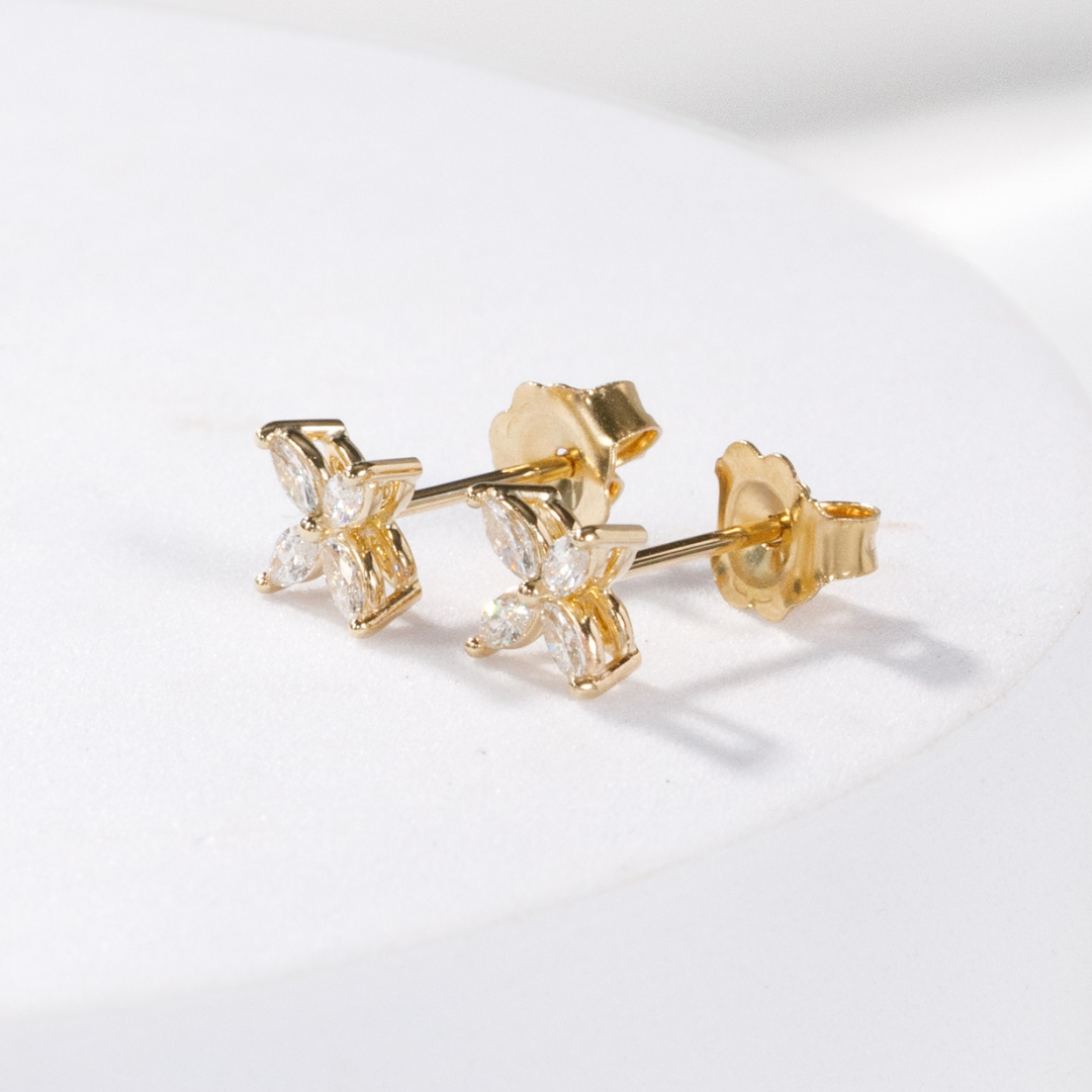 Yellow gold flower earring, close-up.