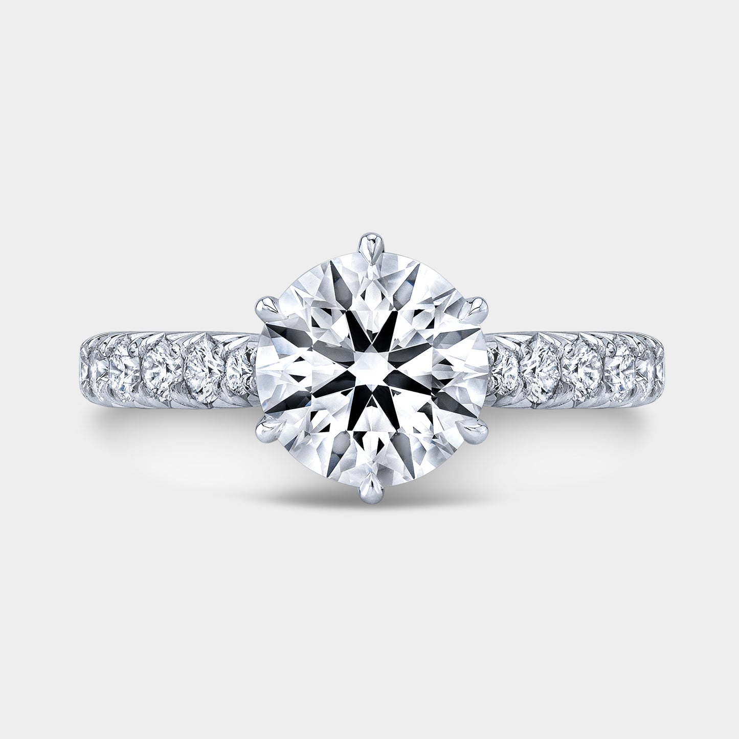 Platinum round ring, top view, tulip pave.