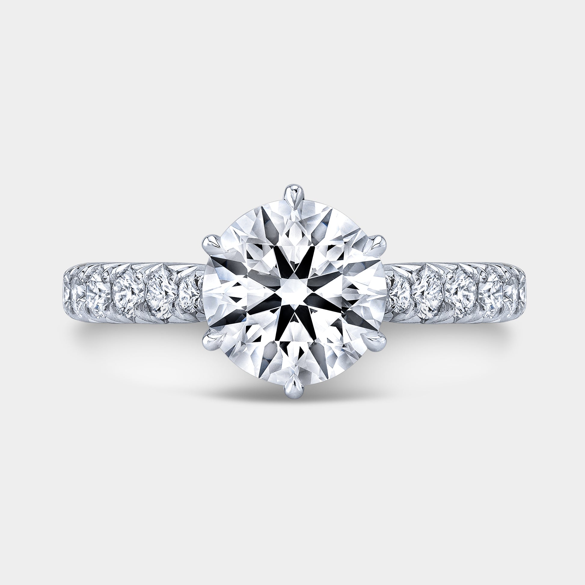 Platinum round ring, top view, tulip pave.
