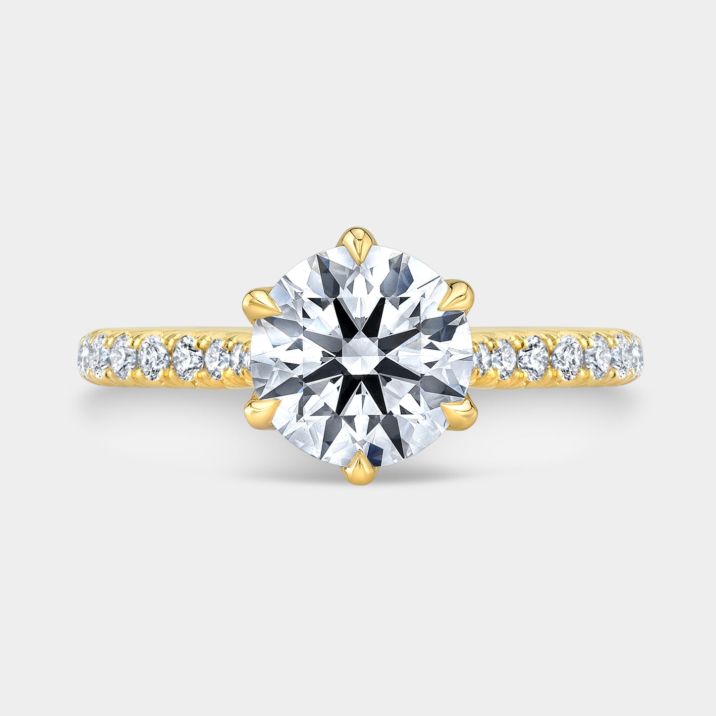 Yellow gold round ring, top view, tulip pave.