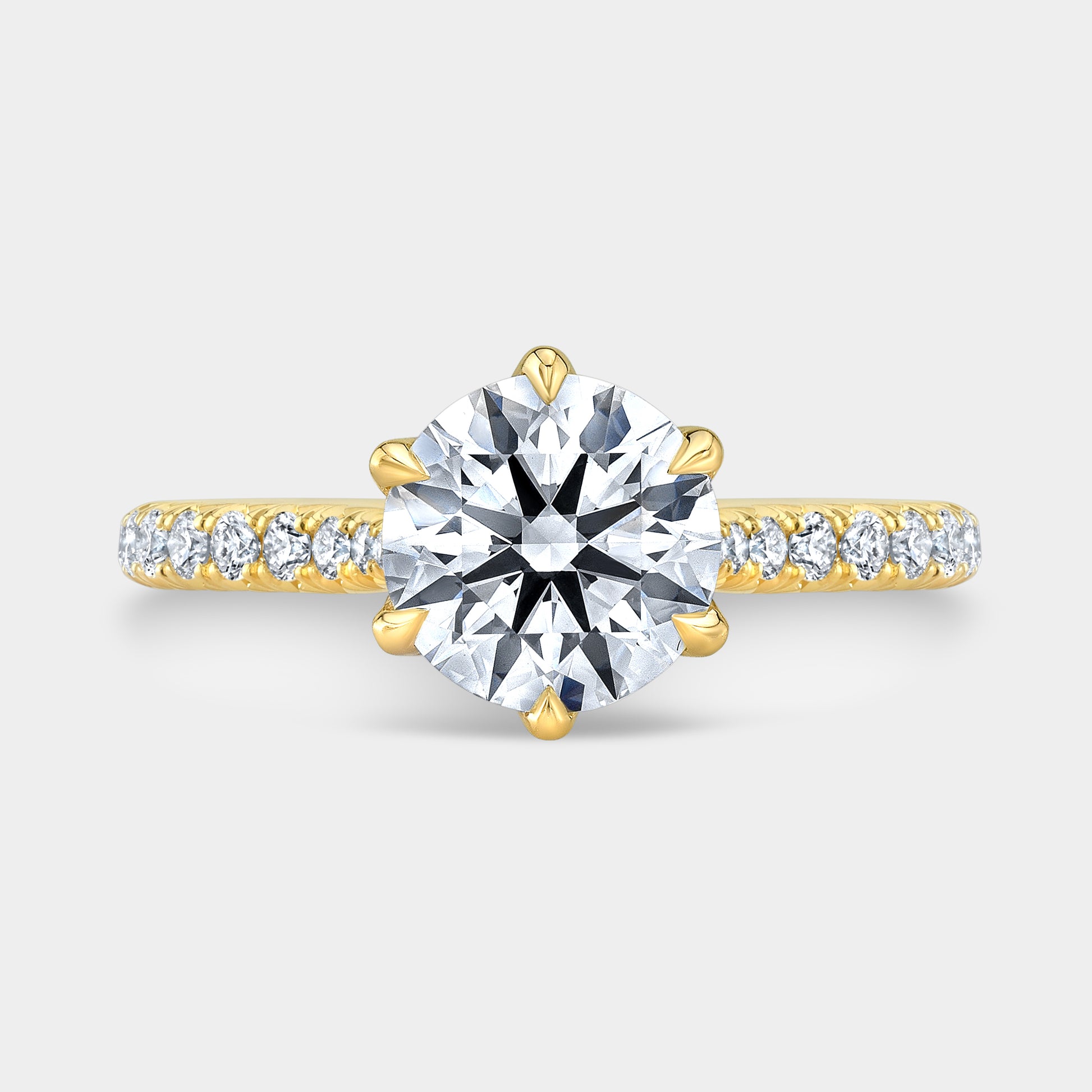Yellow gold round ring, top view, tulip pave.