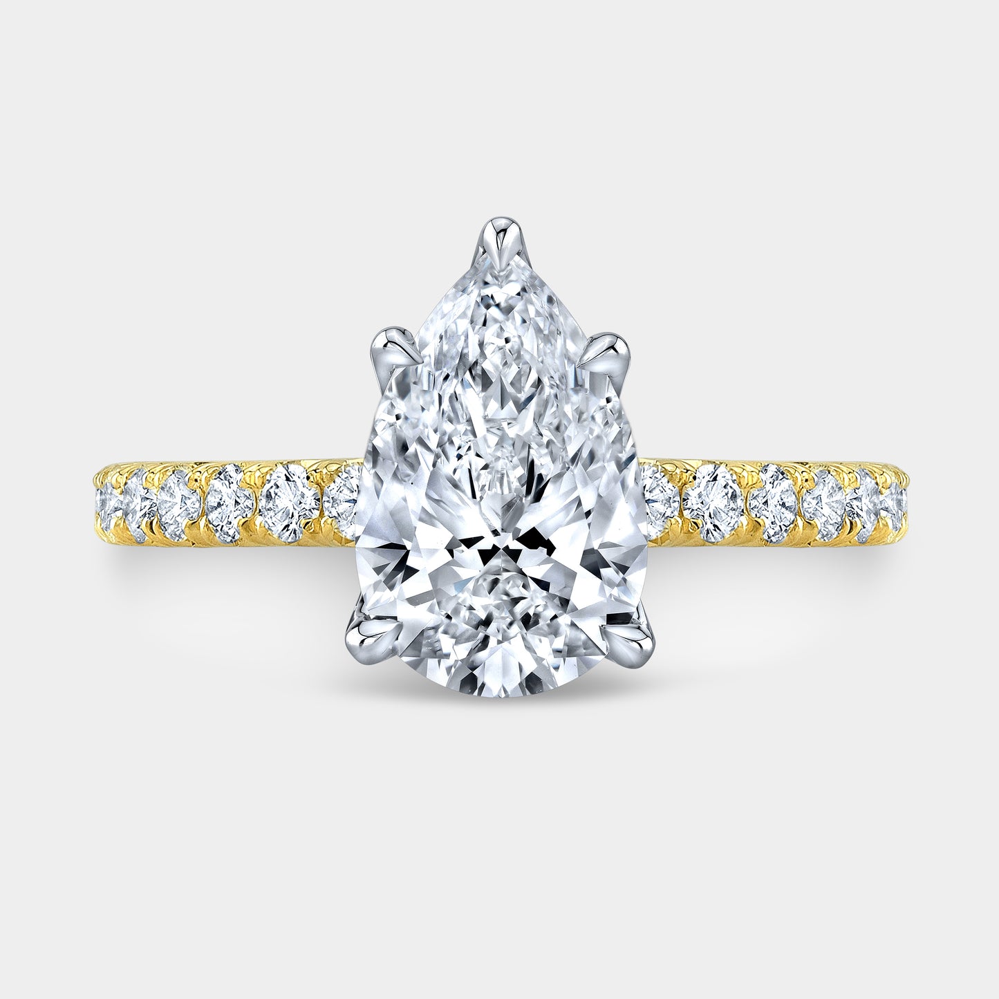 Pear ring, top down, tulip pave solitaire.
