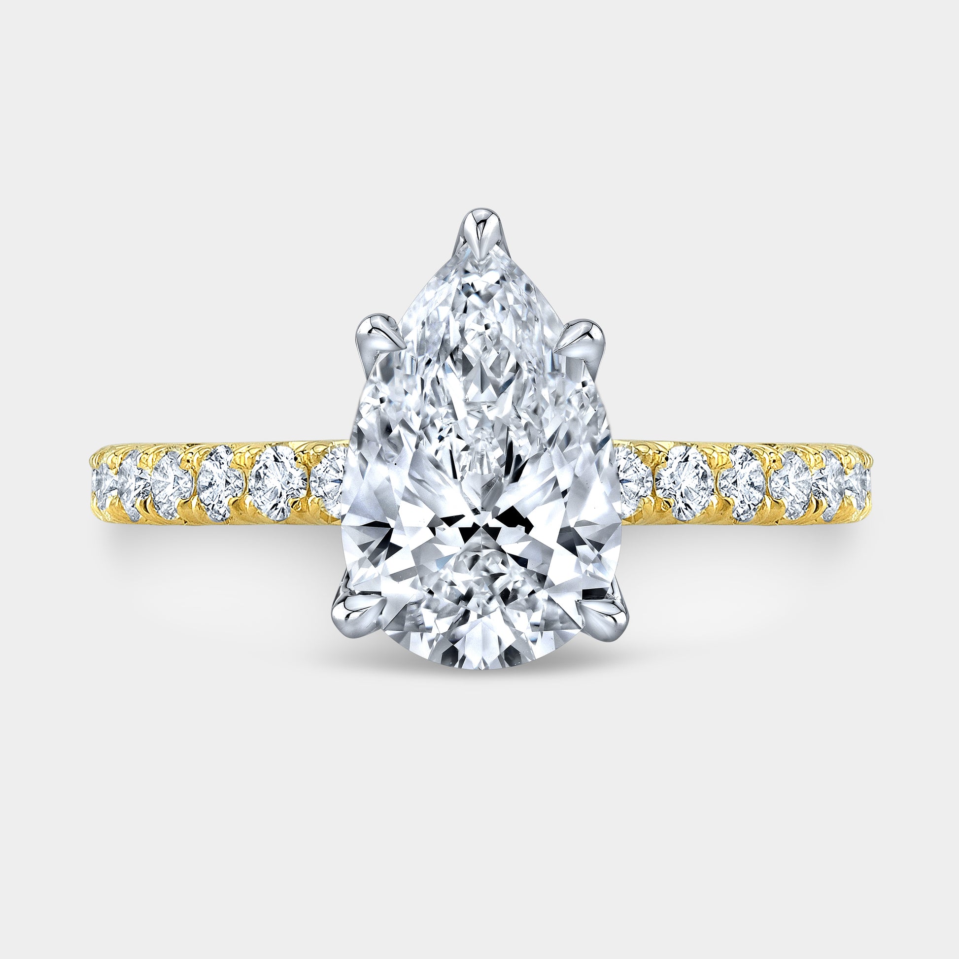 Pear ring, top down, tulip pave solitaire.