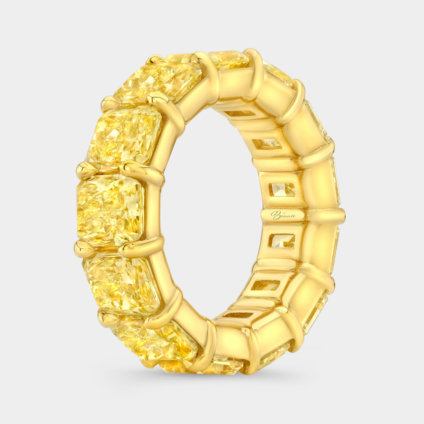 Yellow diamond band, gold setting.