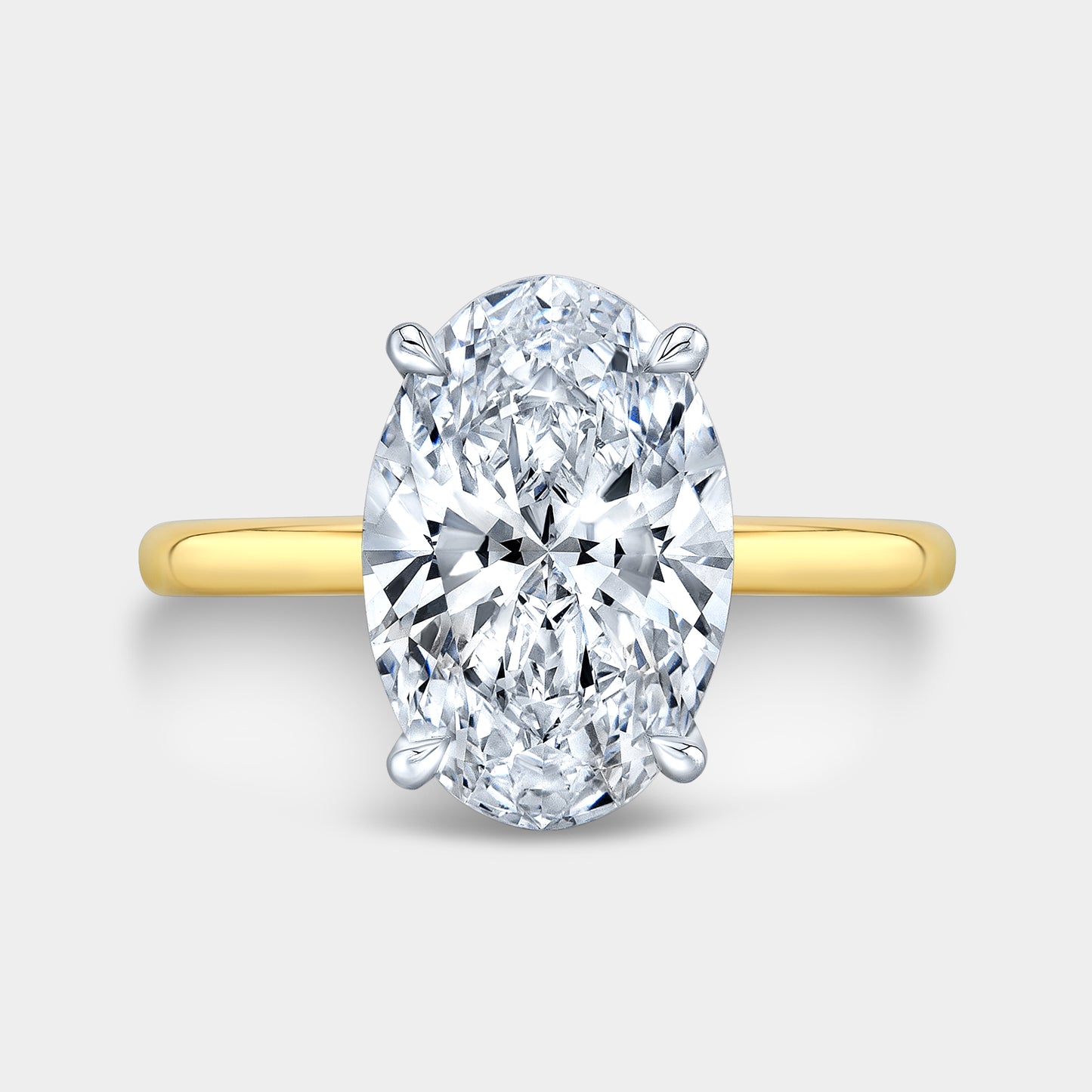 Two tone oval ring, top view, Hailey solitaire.