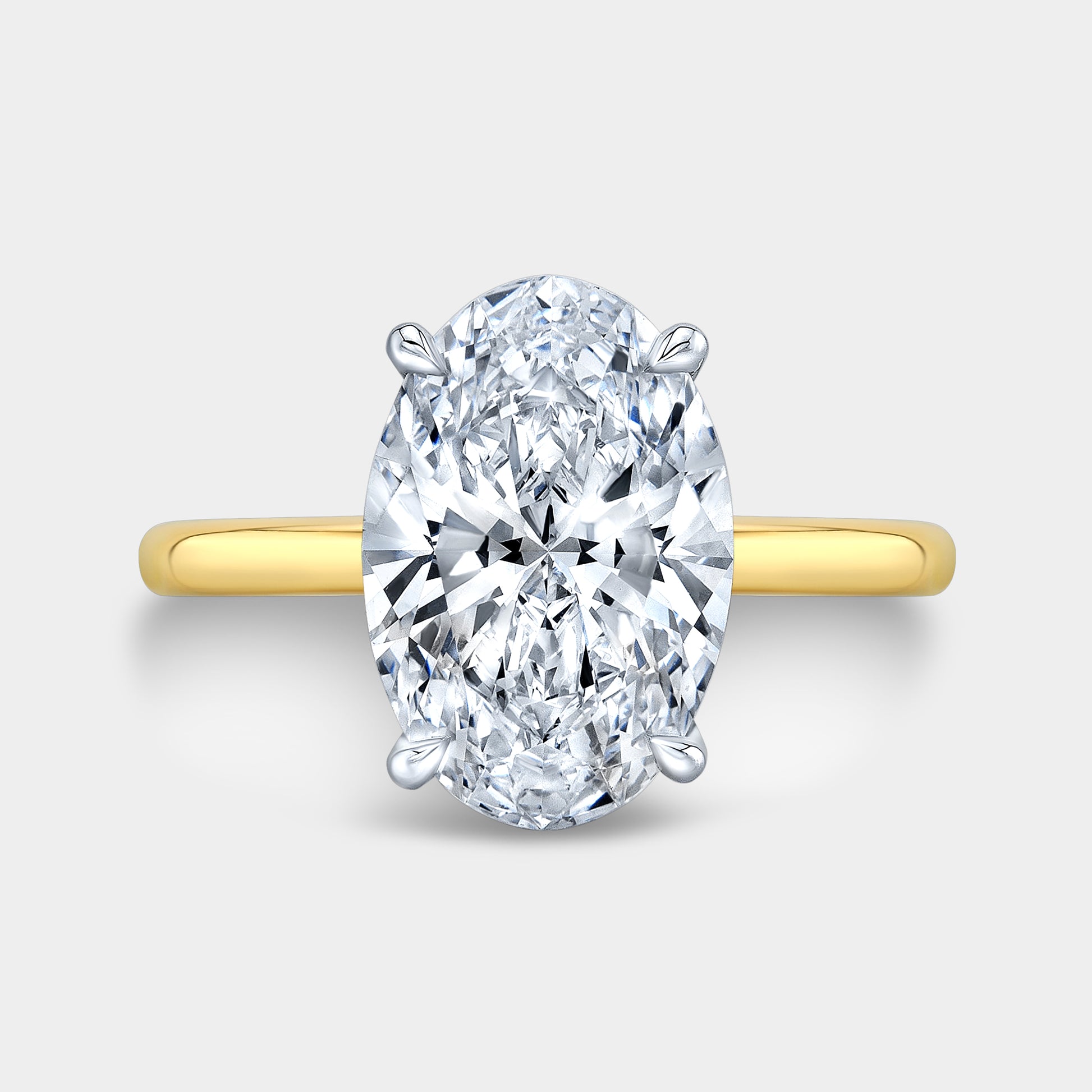 Two tone oval ring, top view, Hailey solitaire.