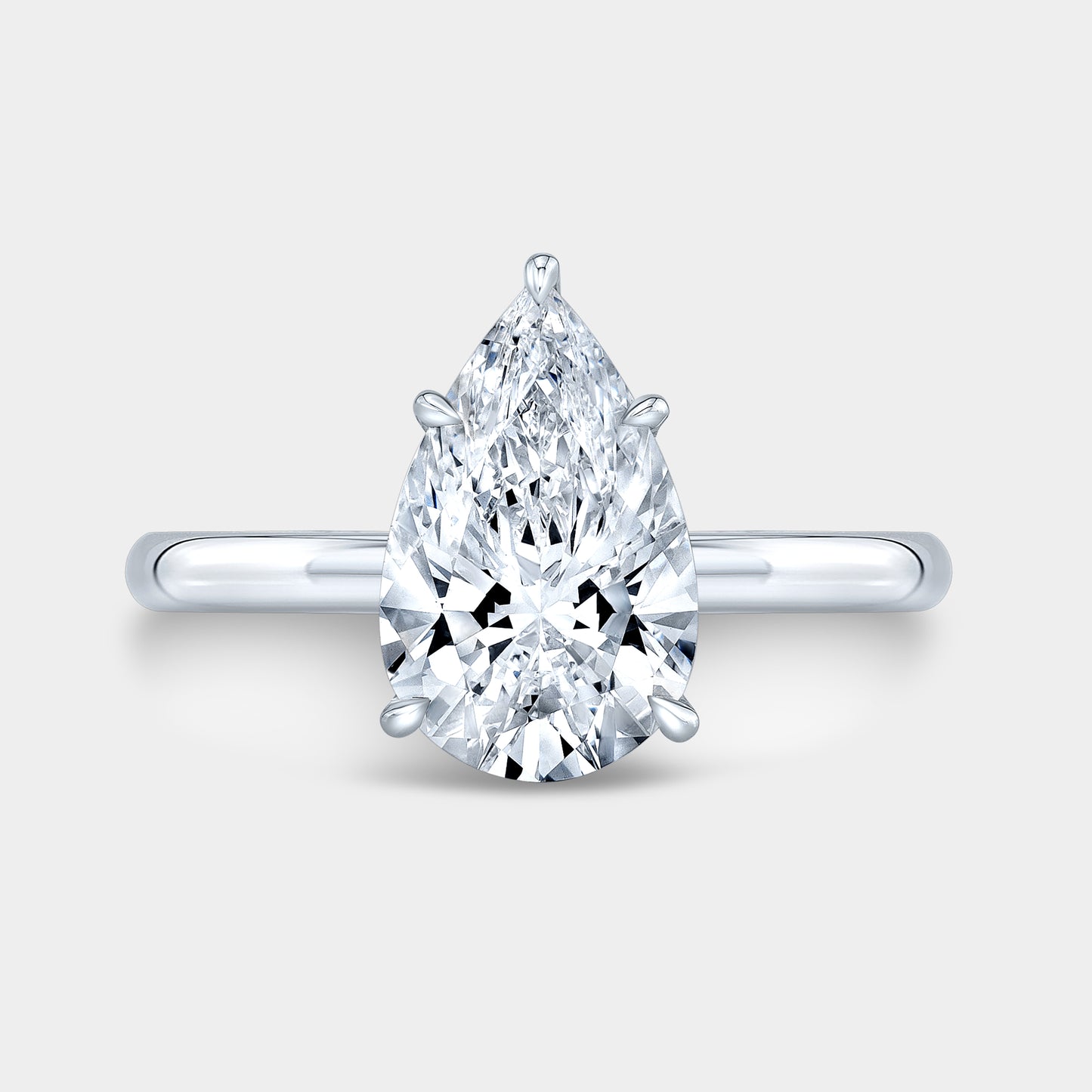 White gold pear ring, top view, hidden halo.