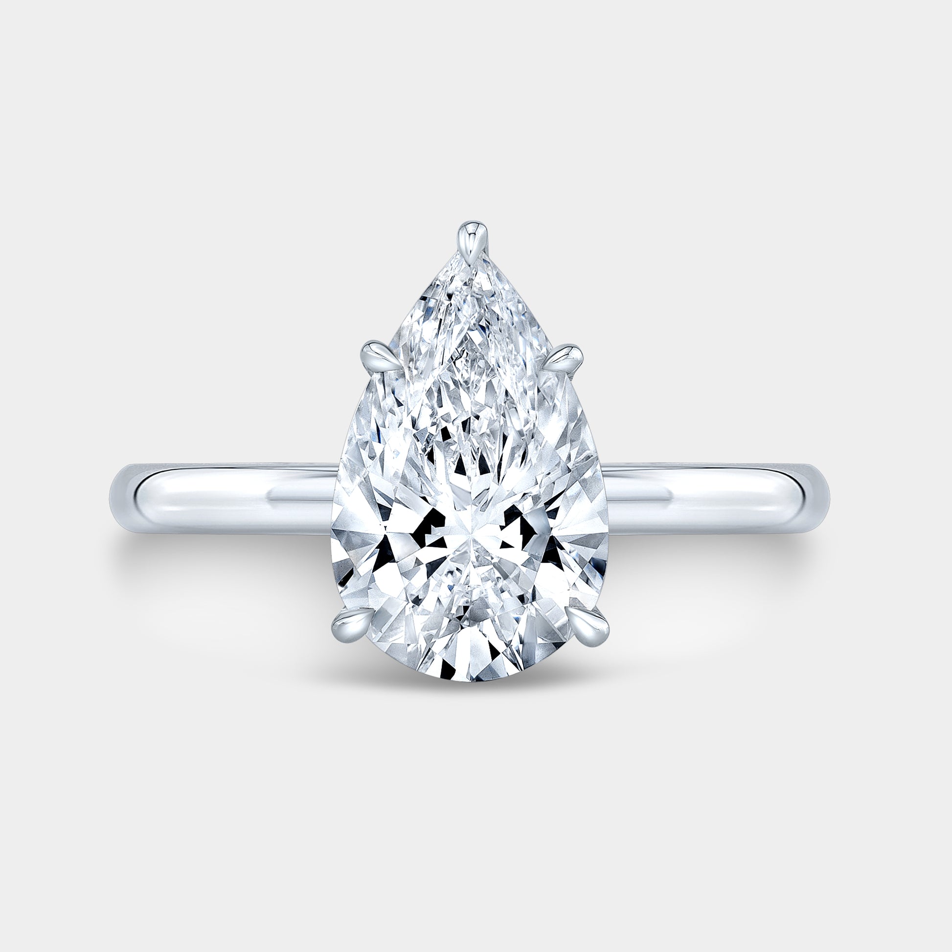 White gold pear ring, top view, hidden halo.