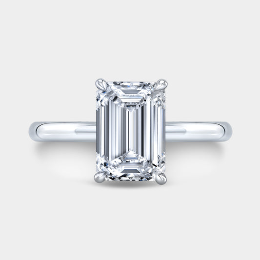 Platinum emerald ring, top view, hidden halo.