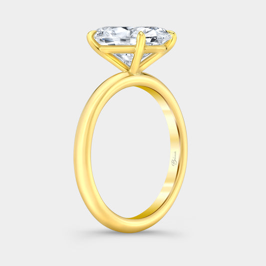 Yellow gold diamond ring on hand, oval solitaire.