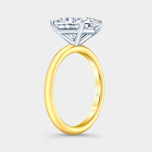 Two tone diamond ring on hand, oval solitaire.