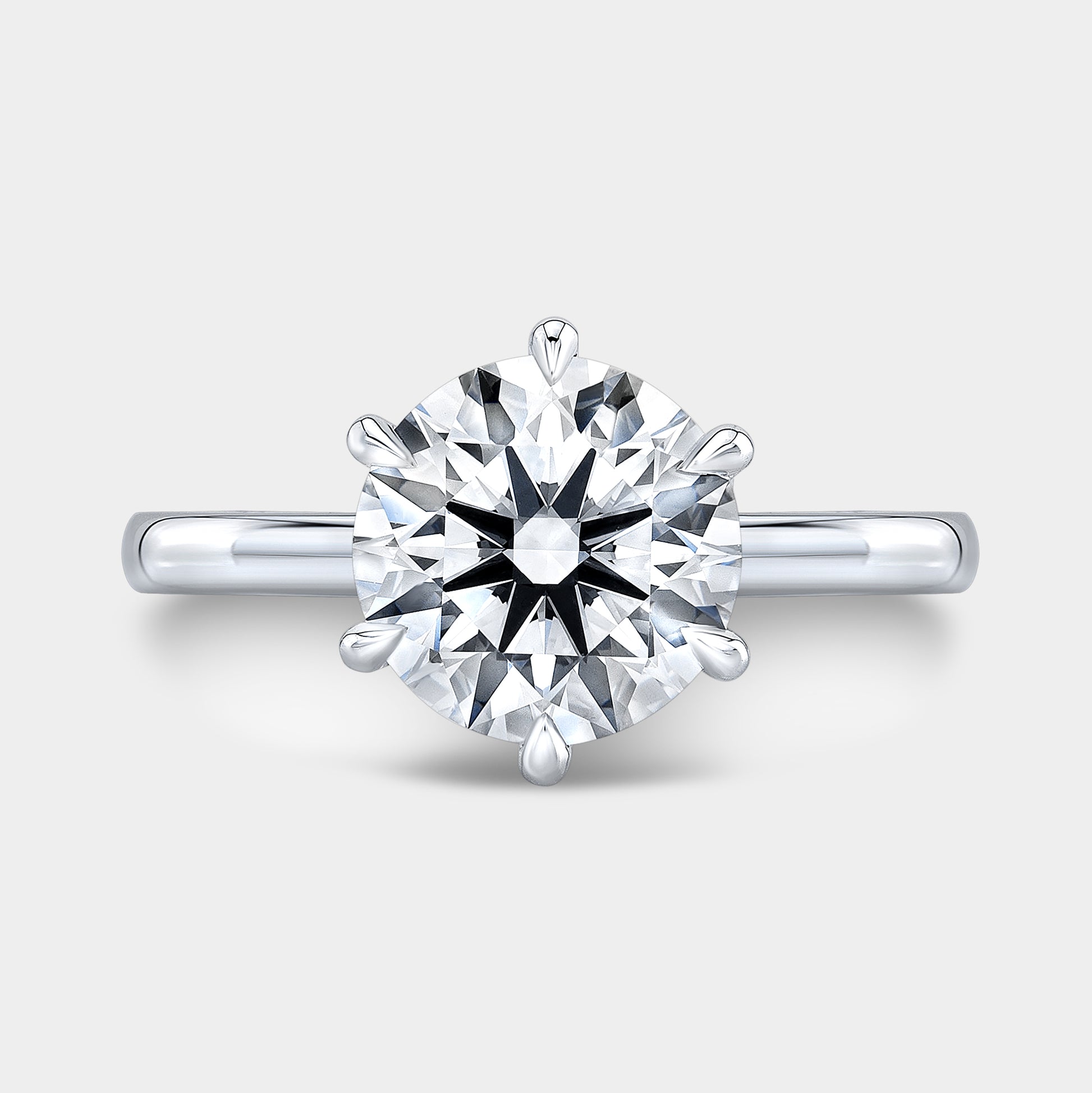 Platinum round ring, top view, hidden halo.