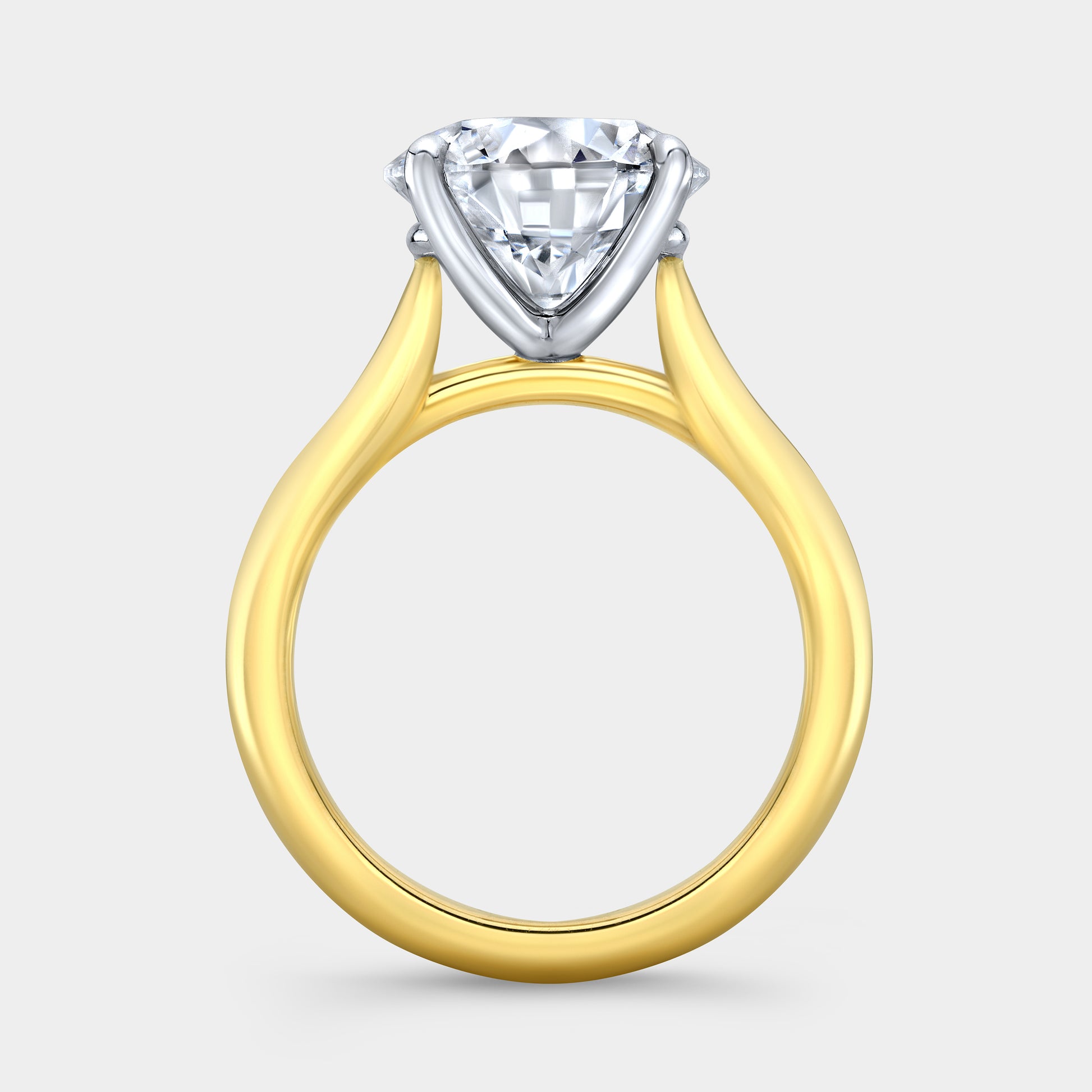 Round solitaire ring, yellow gold & platinum, 4 prong.