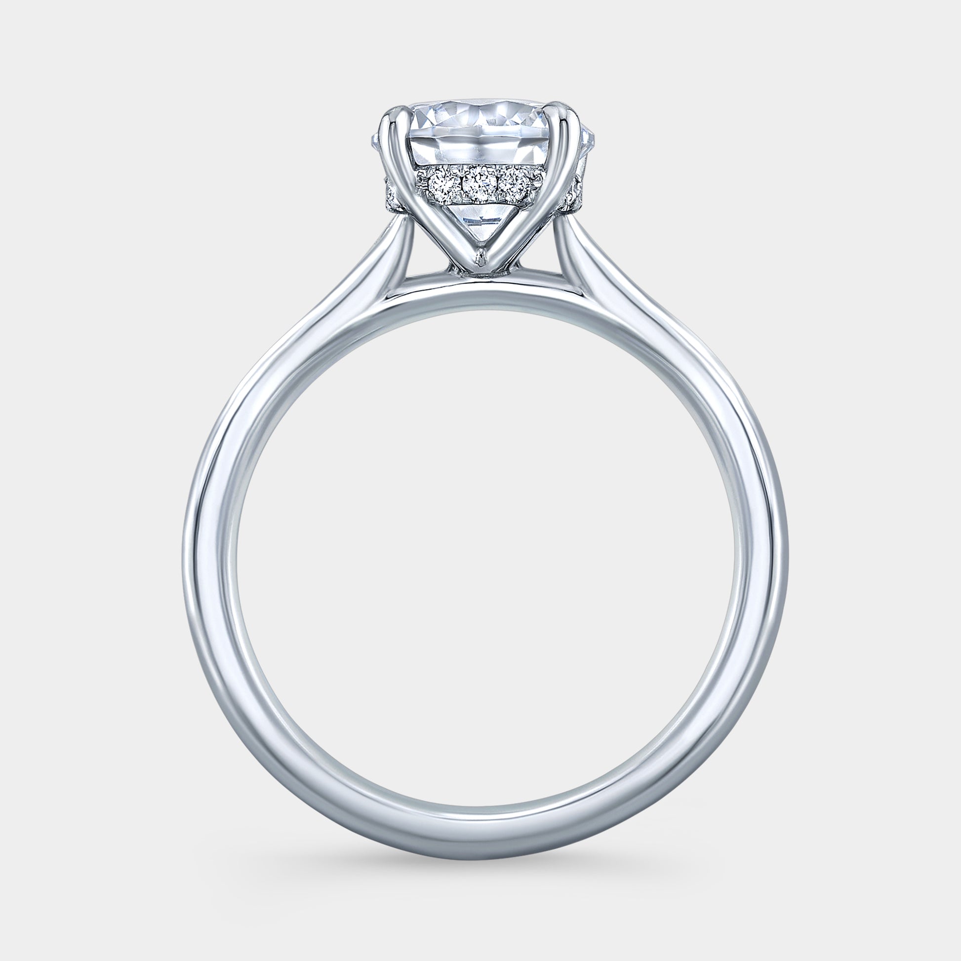 Platinum round ring, hidden halo, 4 prong solitaire.