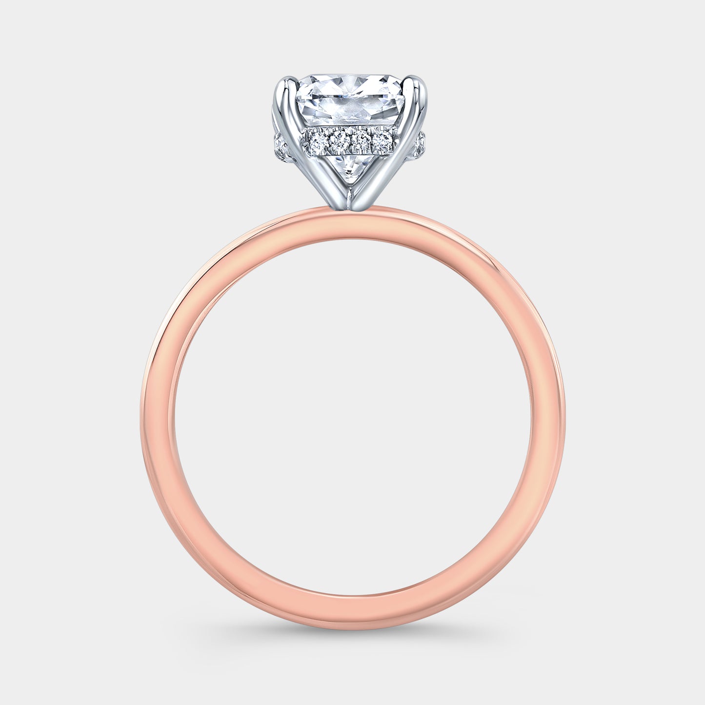 Two tone cushion ring, hidden halo, solitaire setting.