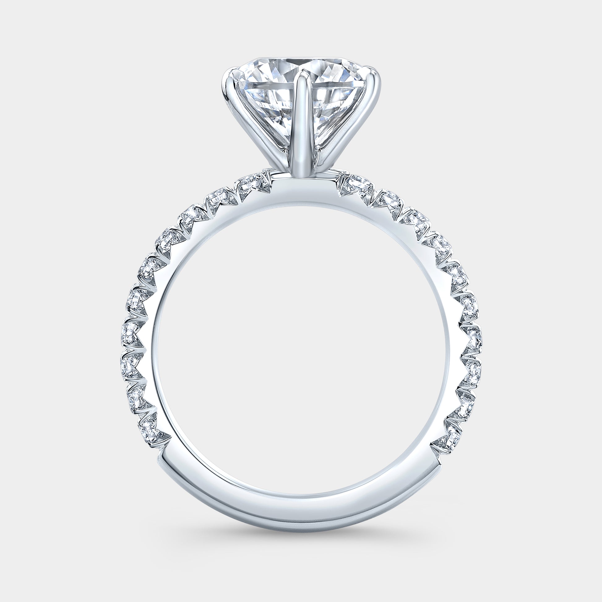 Platinum round diamond ring, 6 prongs, pave band.