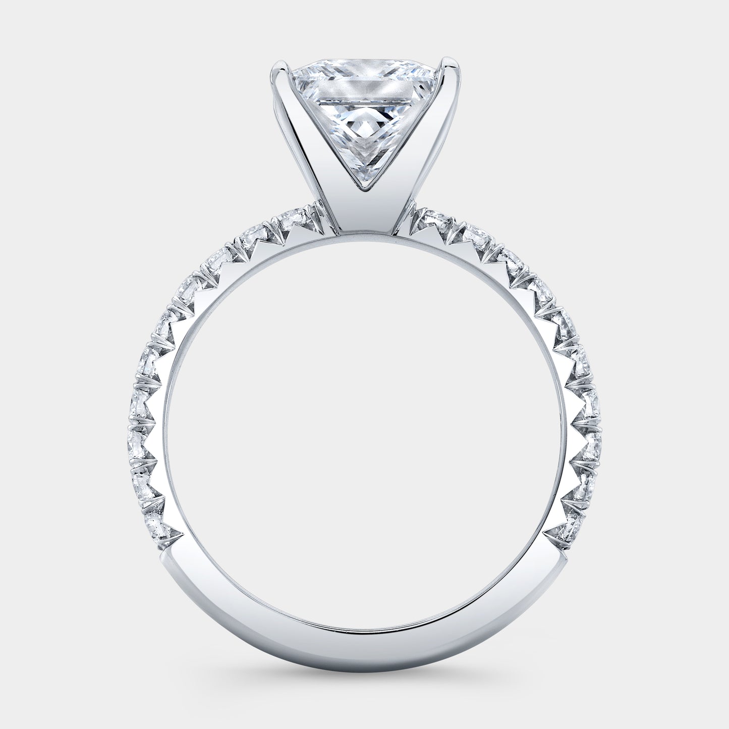 Platinum princess diamond ring, French pave band.