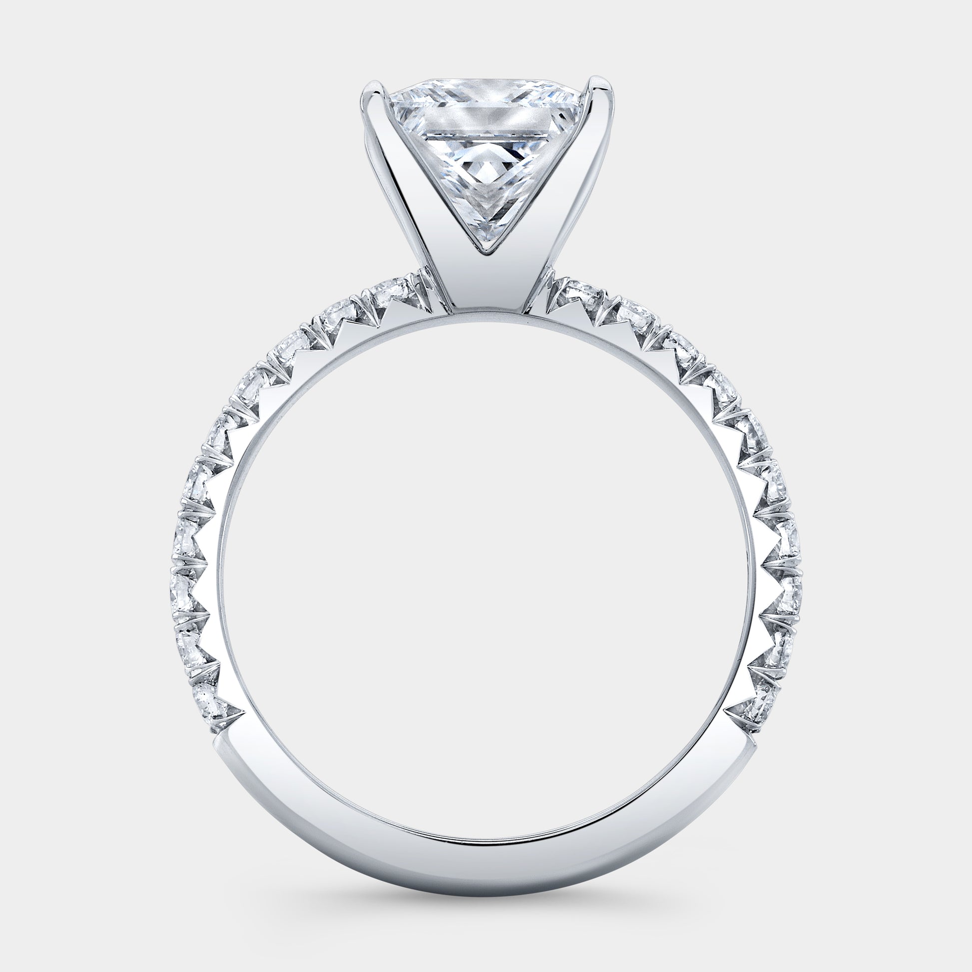 Platinum princess diamond ring, French pave band.