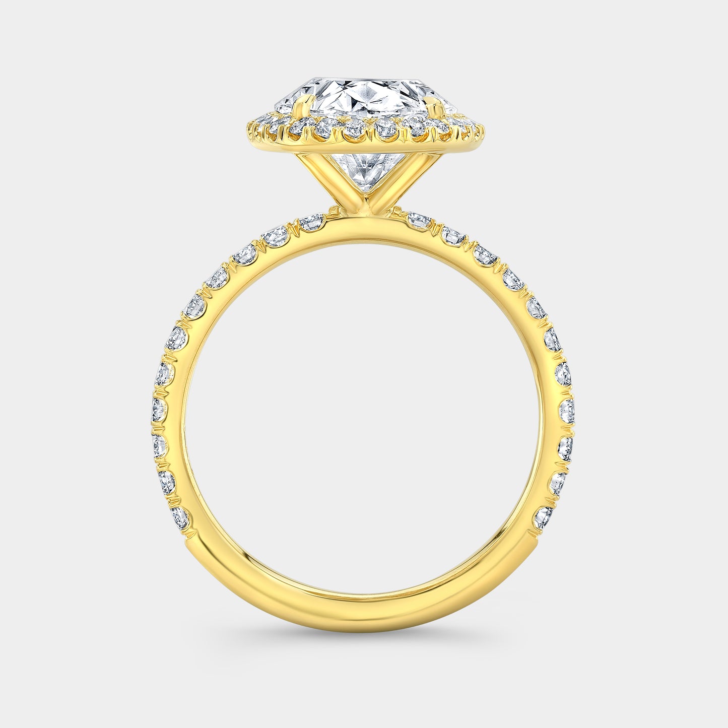 Yellow gold oval ring, petite halo, U pave setting.
