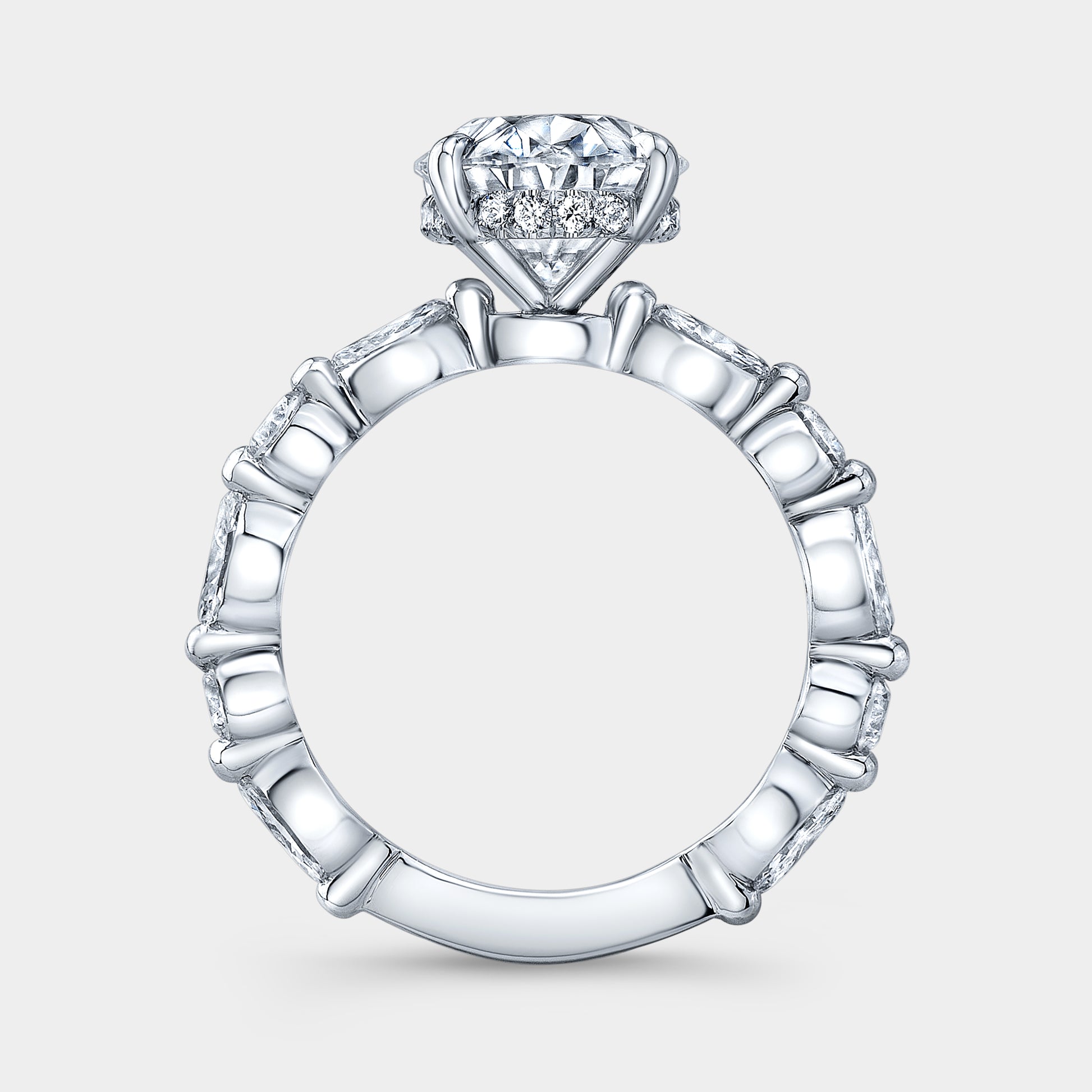 White gold ring, marquise and round accents.