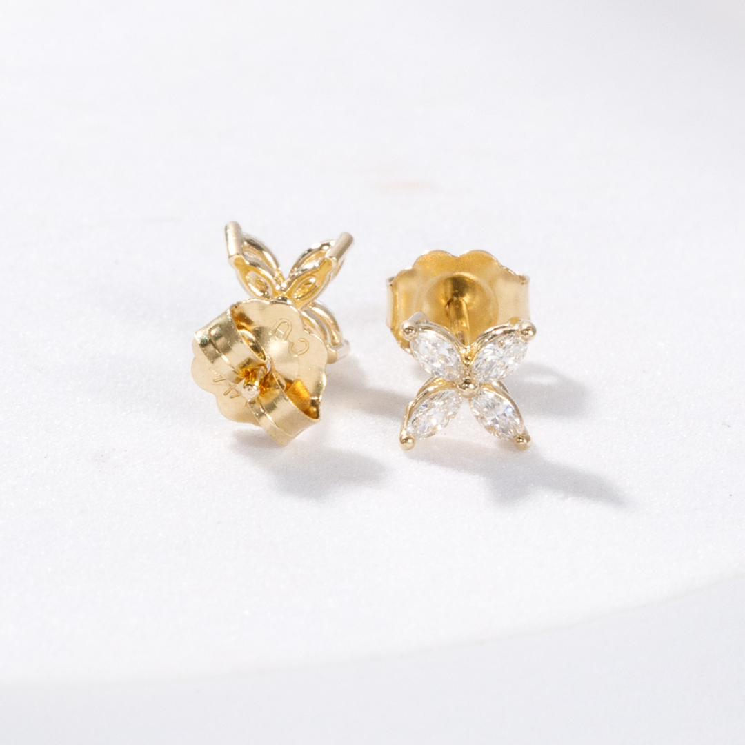 Pair of flower diamond earrings.