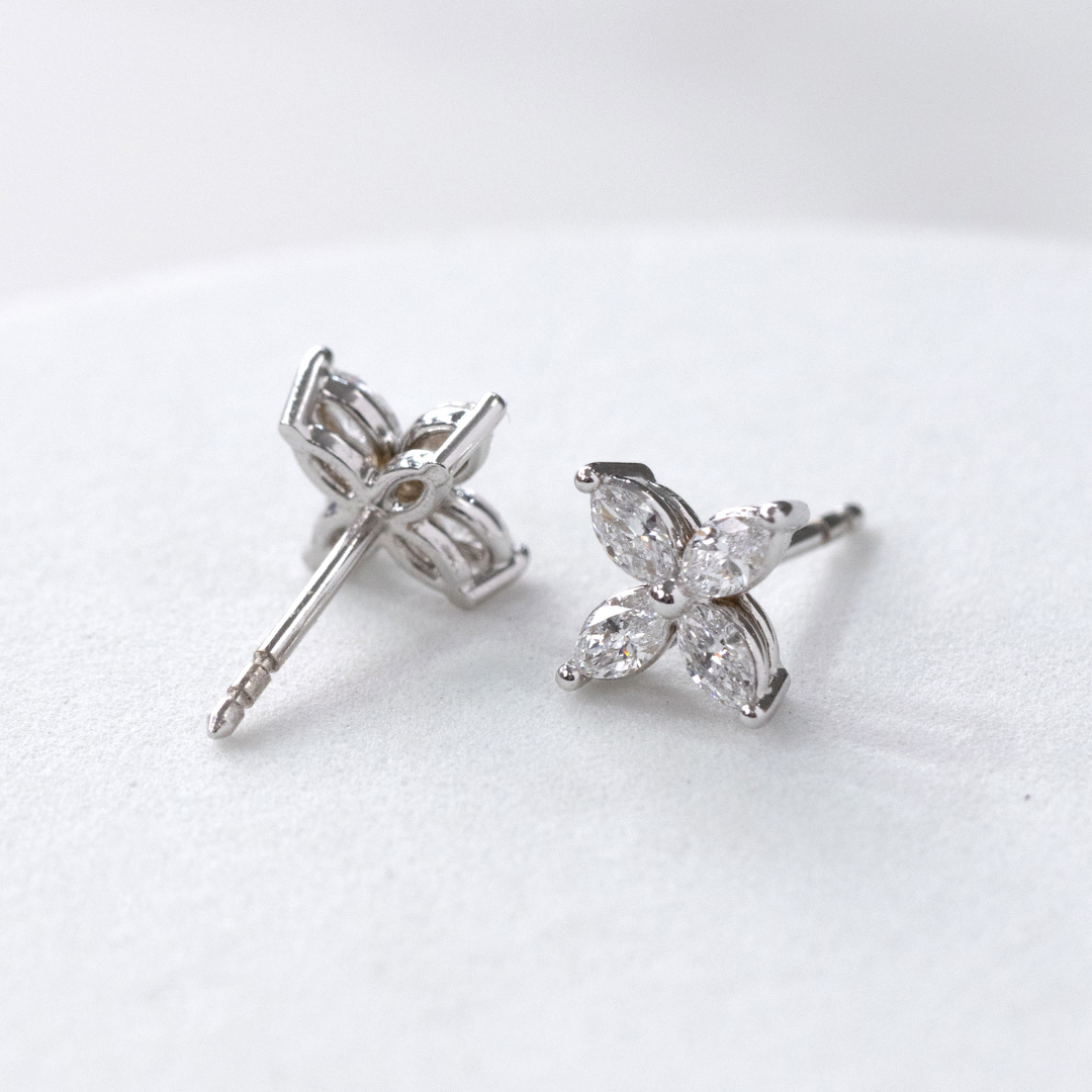 Diamond stud earrings, detail view.