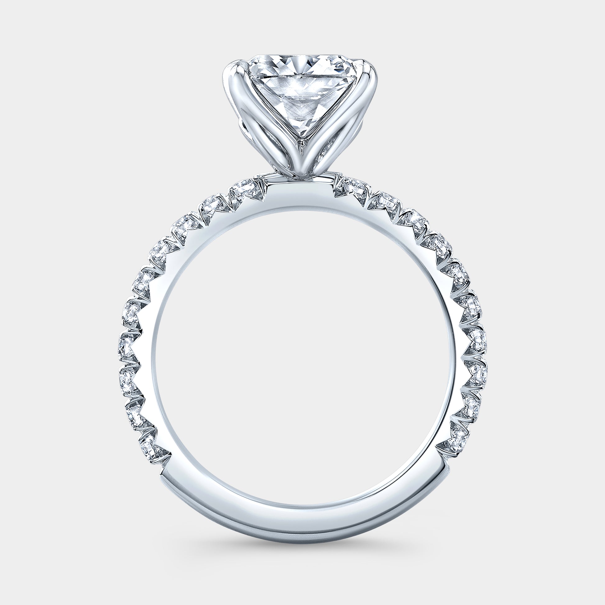 White gold ring, cushion diamond, tulip basket, French pave band.