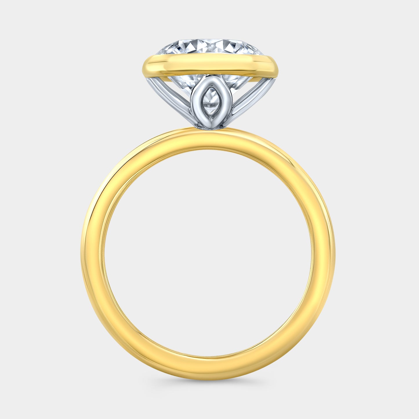 Round solitaire ring, yellow gold & platinum, tulip bezel.